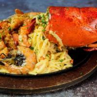 Lobster And Shrimp Thermidor · Lobster Shell Stuffed with Tender Lobster Served with Garlic Linguini and Finished with a Cr...