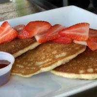Pancakes · Made from whole wheat flour (Gluten Free)  and served with fresh strawberry, banana and ligh...