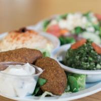 Kibbeh Platter · With two kibbeh, small greek salad, hummus and pita.
