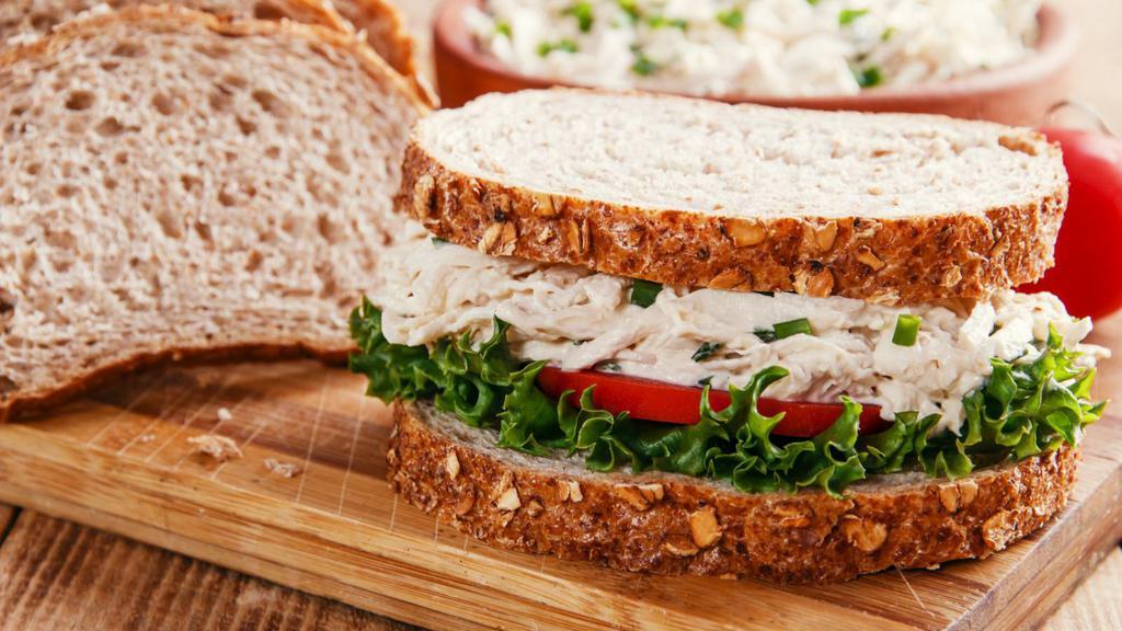Chicken Salad Sandwich · Customer's favorite sandwich made with toasted bread, chicken salad, lettuce, tomatoes, and creamy swiss cheese.
