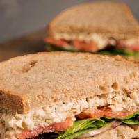 Tuna Sandwich · Tuna, toasted bread, lettuce, tomatoes, black olives, and cucumbers.