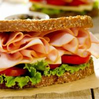 Ham Sandwich · House-made ham sandwich that comes in toasted bread, lettuce, tomatoes, provolone, and slice...