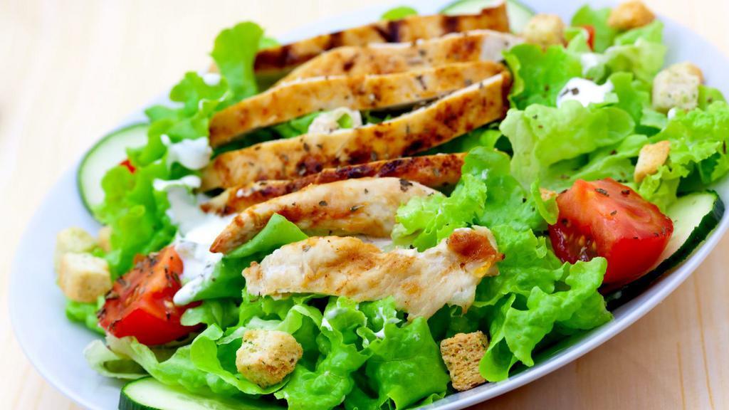 Grilled Chicken Salad · Grilled white meat chicken mixed with lettuce, tomatoes, cucumbers, olives, and topped with parmesan cheese with a side of house dressing.