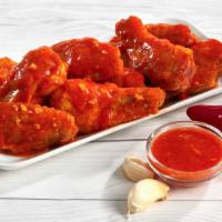 Serious Buffalo Wings · Stay with the classics! Roasted chicken wings tossed in a traditional buffalo sauce.