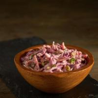 Spicy Coleslaw Salad · Freshly shaved Cabbage, carrots and chives dressed in our homemade Cayenne pepper spicy mayo...