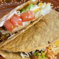 Crispy Taco: Pollo///Chicken · Grilled chicken served on our in-house fried corn tortilla, topped with lettuce, tomato, shr...