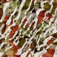Nachos: Carne Asada///Steak · in-House fried tortilla chips with steak, chopped tomatoes, shredded lettuce, jalapenos, sou...