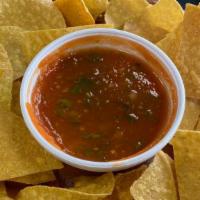 Chips & Salsa · salsa prepared with plum tomatoes, onion, cilantro, and serrano peppers. Served with our fri...