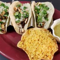 Street Tacos · 3 soft corn tortillas with cilantro and onions. Choice of carne asada, chicken carnitas, pas...
