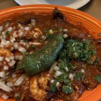 Toro Loco · Grilled chicken, steak and shrimp topped with onions, cilantro, jalapeño pepper and hot sauc...