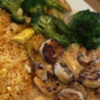 Camarones Chipotle · 10 grilled shrimp topped with our new chipotle/cheese sauce. Served with rice and vegetable.