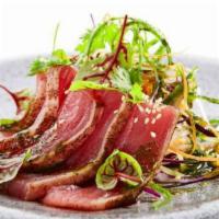 Tuna Tataki · Char-broiled sliced tuna with special sauce.

Advisory: consuming raw or uncooked meats, pou...