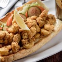 Shrimp Po Boy · Hand-battered, golden fried, dressed and served overstuffed. Served with french fries