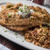 Crab Stuffed Catfish Bordelaise	 · Broiled catfish with lump crabmeat stuffing, served with Shrimp Creole rice and one side
