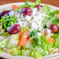Greek Salad · Lettuce, sliced tomatoes, cucumbers, onions, olives, feta cheese lemon juice and olive oil.