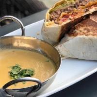 The Big Frank Crunch Wrap · 8oz burger + caramelized onion + spicy aioli + candied bacon + tostada + queso + all wrapped...