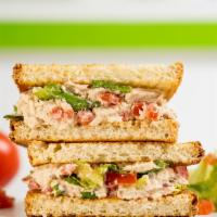 Tuna Panini · Albacore tuna salad with romaine, tomato, and mayo on toasted panini bread.
