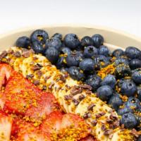 Busy Bee Bowl · Acai, almond milk, banana, strawberry, blueberry, and raspberry topped with blueberry, straw...