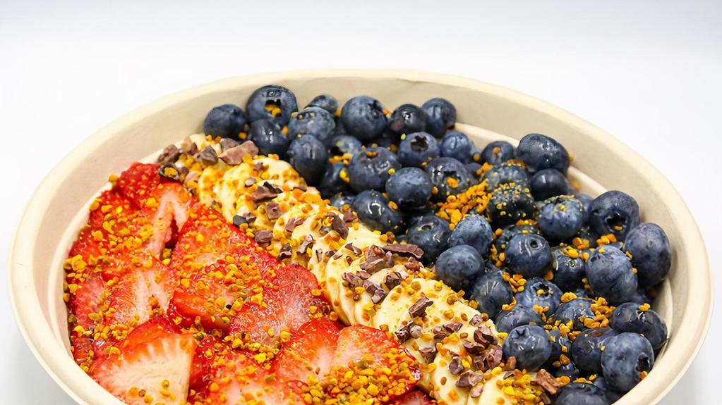 Busy Bee Bowl · Acai, almond milk, banana, strawberry, blueberry, and raspberry topped with blueberry, strawberry, banana, honey, bee pollen, and cacao nibs.