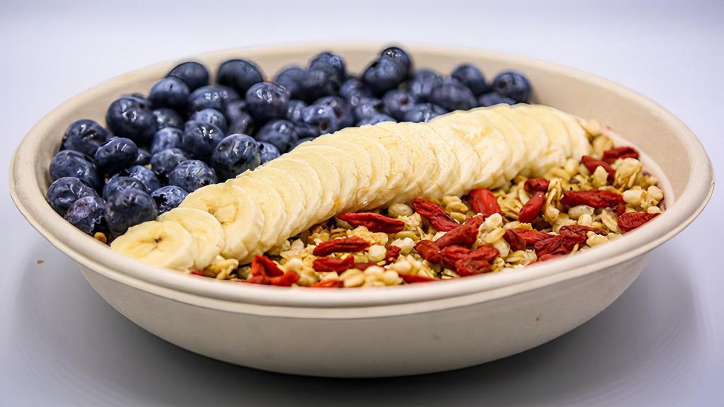 Scottie Bowl · Acai, almond milk, banana, strawberry, blueberry, raspberry, peanut butter topped with flax and hemp granola, goji berry, blueberry, and banana.