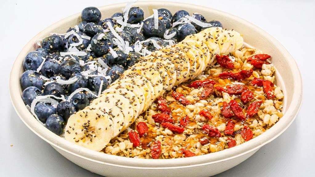 Coco Berry Bowl · Acai, almond milk, banana, strawberry, blueberry, raspberry, and ginger topped with flax and hemp granola, banana, coconut flakes, chia seeds, flax seeds, goji berries and honey.