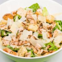 Chicken Caesar Salad · Crisp romaine leaves, shaved Parmesan, croutons, and diced hormone-free chicken in our signa...