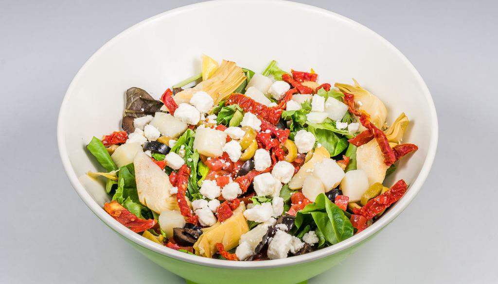 Mediterranean Salad · Gluten-free, vegetarian. Greens, diced and sun-dried tomato, red peppers, green, and black olives, heart of palm, artichoke, and feta in balsamic vinaigrette.