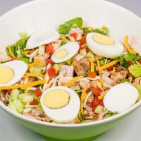 The Chef Salad · Romaine leaves with turkey, chicken, egg, tomato, cucumber, and mixed cheeses tossed in ranc...
