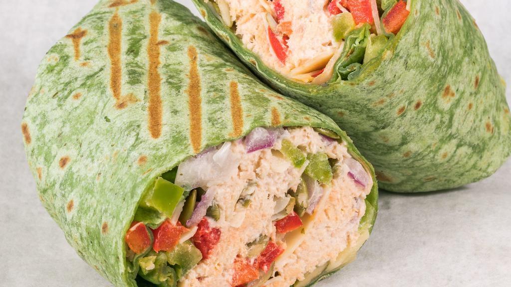 Spicy Albacore Tuna Wrap · Spinach wrap with tuna, red and green peppers, onion, pumpkin seeds, parmesan cheese, and chipotle dressing.