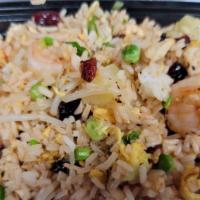 Polynesian Fried Rice · House fried rice with pineapple, shrimp, chicken and raisins.