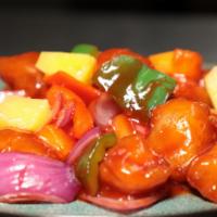 Sweet & Sour Chicken · Coated and fried with pineapple chunks, bells peppers and onions glazed in a sweet and sour ...