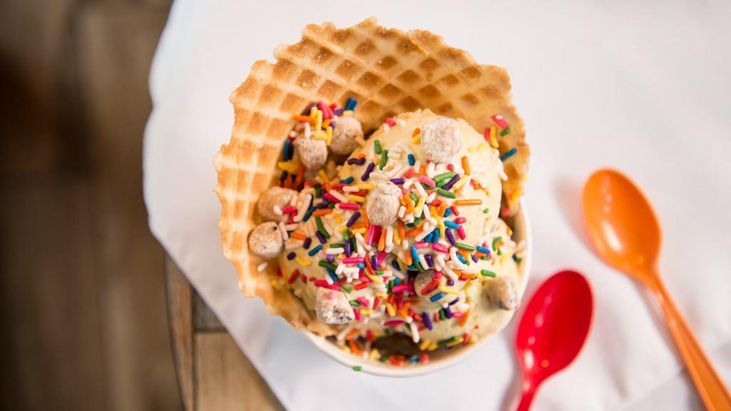 Birthday Cake Capacitor Ice Cream · Cake batter and fudge ice cream with cookie dough and sprinkles in a waffle bowl
