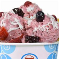 Tropical Turbine Ice Cream · Coconut and black raspberry ice cream with mixed berries and coconut flakes in a waffle bowl