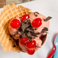 Cherry Charge Ice Cream · Cherry flavored ice cream with chocolate flakes and cherries in a waffle bowl