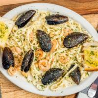 Seafood Alfredo · Served with salad and garlic bread. Mussels, scallops and shrimp in creamy Alfredo sauce.