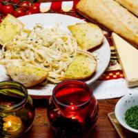 Fettuccine Alfredo With Steak · Served with salad and garlic bread. Fettuccine pasta tossed in our creamy Alfredo sauce with...