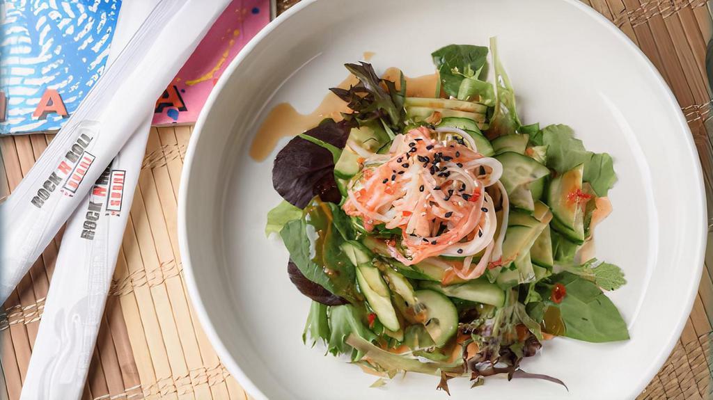 Cucumber Salad · Crab stick and thinly sliced cucumbers served on a bed of spring mix. Glazed with ponzu, sweet chili sauce, and sprinkled with sesame seeds.