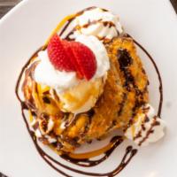 Hall Of Fame Brownies · Fried brownie served with vanilla ice cream. Topped with whipped cream and drizzled with cho...