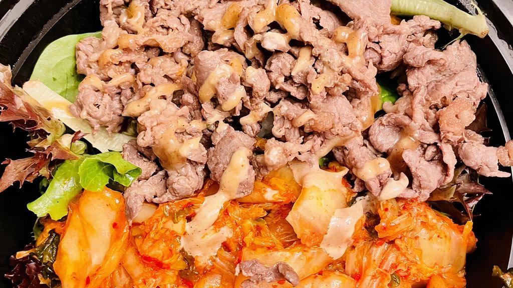 Kimchi Bowl · Steamed white rice, kimchi, bulgogi, fresh green salad, sesame sauce.