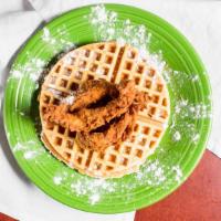Chicken 'N Waffles · Golden-fried chicken tenders, piled on our homemade orange-rosemary waffles, diced bacon and...