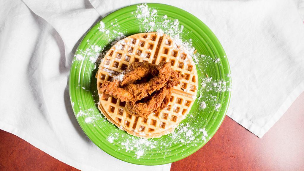 Chicken 'N Waffles · Golden-fried chicken tenders, piled on our homemade orange-rosemary waffles, diced bacon and a balsamic caramel reduction. 1448 cal.