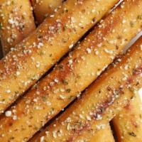Italian Breadsticks · Garlic butter, pecorino, and marinara.