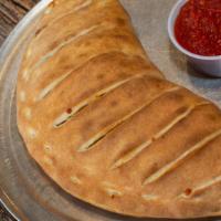 Steak & Cheese Calzone · Fried onions and mozzarella cheese.