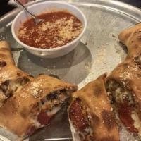 Stromboli · Pepperoni, sausage, mushroom, green pepper, onion, and mozzarella baked in a pizza dough.