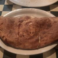 Cheese Calzone · Ricotta and mozzarella cheese baked in a fresh-made pizza dough.