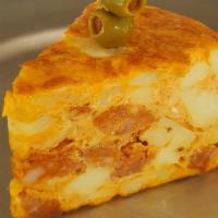 Tortilla De Chorizo · Spanish style potatoes, eggs, onions and chorizo omelet.