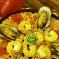 Paella Valenciana · Spanish paella cooked with shrimp, scallops, mussels, fish and calamari.
Paella for 2