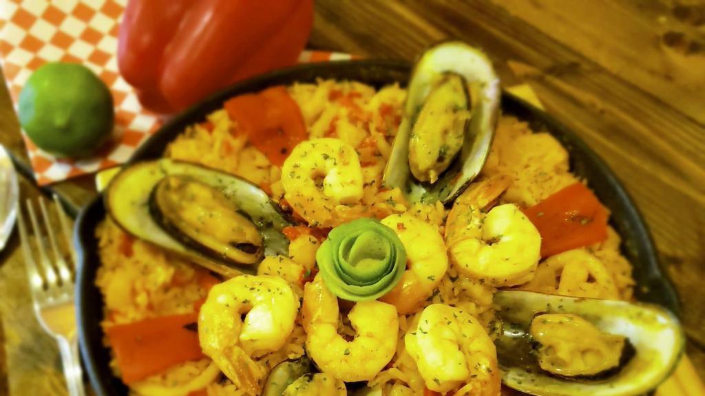Paella Valenciana · Spanish paella cooked with shrimp, scallops, mussels, fish and calamari.
Paella for 2