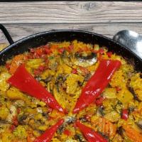 Paella De Vegetales · Rice cooked with carrots, mushrooms, onions and peppers.
Paella for 2
