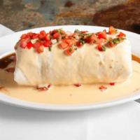 Raging Queso Burrito · Steak, grilled or chipotle chicken or tofu with sautéed bell peppers, onions, mushrooms and ...